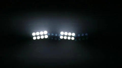 Bright stadium floodlights illuminating the dark night sky at a sports arena. Stock Footage 344963033