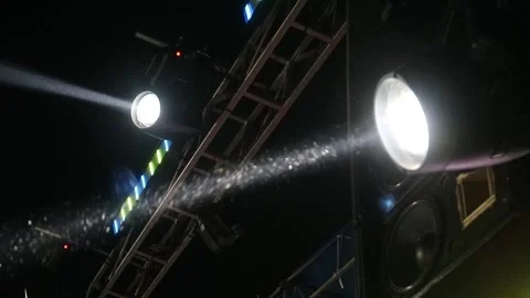 Bright stage lights shining in the dark night sky during a live concert event. Stock Footage 344961647