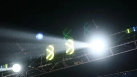 Bright stage lights shining in the dark night sky during a live concert event. Stock Footage 344961945