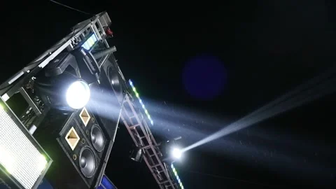 Bright stage lights shining in the dark night sky during a live concert event. Stock Footage 344962293