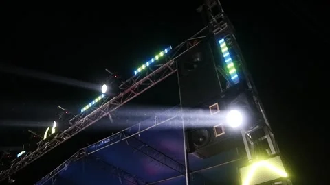 Bright stage lights shining in the dark night sky during a live concert event. Stock Footage 344962750