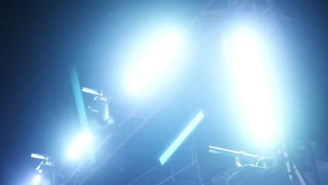 Bright stage lights shining in the dark night sky during a live concert event. Stock Footage 344963056