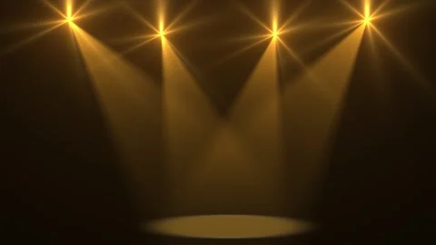 A bright stage with a lit circular podium and rows of orange spotlights above Vídeos de archivo 328582228