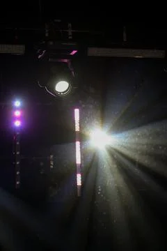 Bright Stage Spotlight with Dramatic Light Rays in Dark Stock Photos