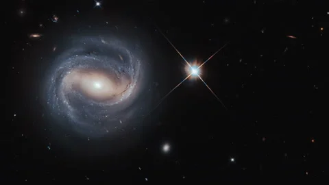 Bright star in a night sky with helical galaxy Stock Footage 154376025
