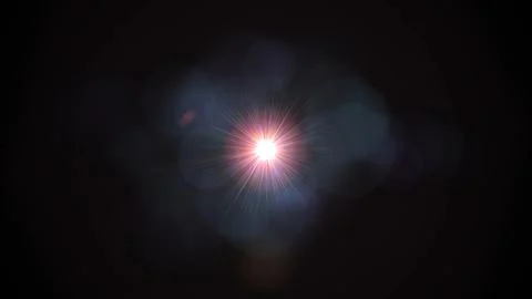 Bright starburst glows against deep black background Stock Illustration