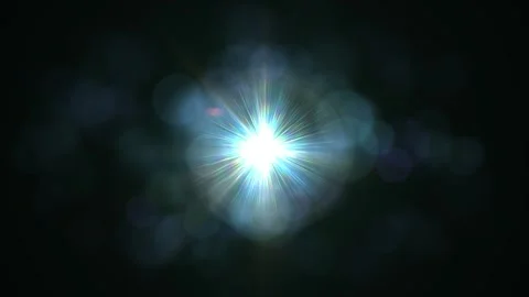 Bright Starburst Light Flare Effect with Bokeh on Dark Background Stock Footage 337226292