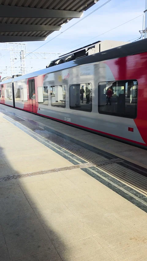 Bright station scene. Train at calm urban platform. Morning scene 스톡 동영상 330440364