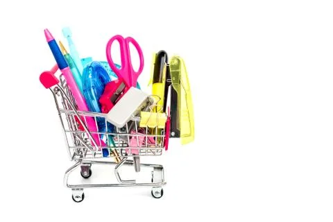 Bright stationery objects in mini supermarket cart on white background Stock Photos