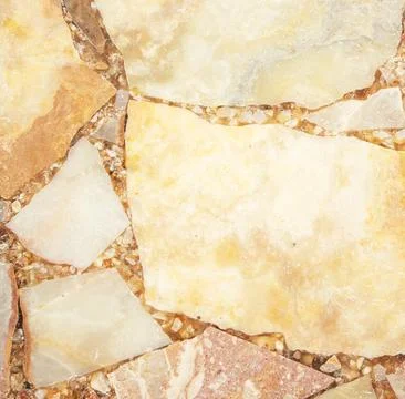 Bright stone background from compressed marble fragments Stock Photos