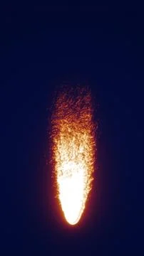 A bright stream of falling fire particles glowing against a dark background.. イラスト素材