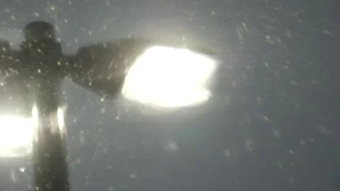 Bright street light or security light shining in rain slow motion Stock Footage 150478580