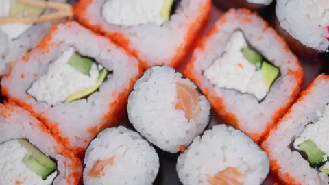 Bright studio setting with meticulously arranged fresh sushi pieces. Chef carefu Stock Footage 329511751