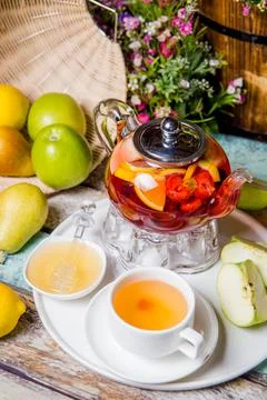Bright summer fruit tea on the table in the restaurant Stock Photos