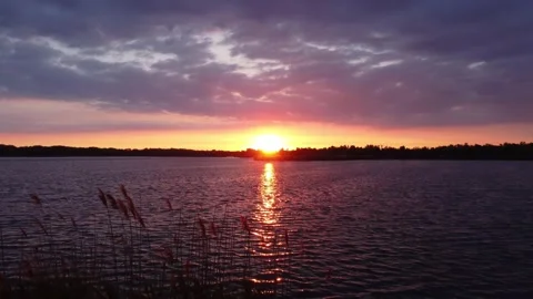 Bright Summer Sunset over the River. Flying with Drone. Stock Footage 155785058