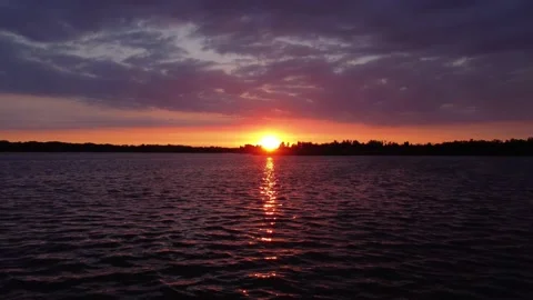 Bright Summer Sunset over the River. Flying with Drone. Stock Footage 155785694
