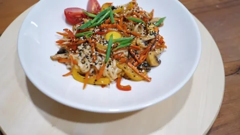 Bright summer vegetable salad with chicken yolk rotates on a white plate Stock Footage 201965013