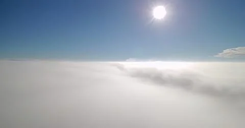 Bright sun above a cloudy sky on a clear day Fotos Stock