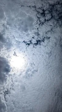 The bright sun and clouds making the blue sky look like a bomb explosion Stock Photos