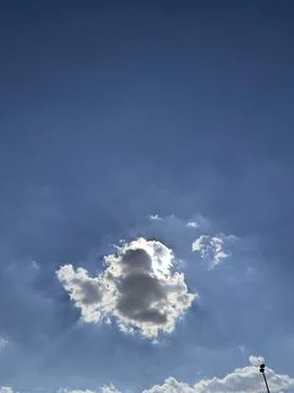 Bright Sun Behind Small Cloud Close Up Foto stock