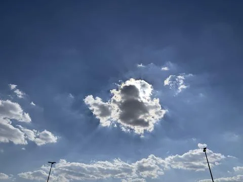 Bright Sun Behind Small Cloud Detailed View Stock Photos