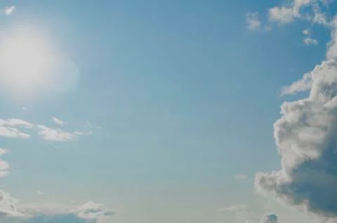 Bright sun in cloudy sky. Copy space Stock Photos