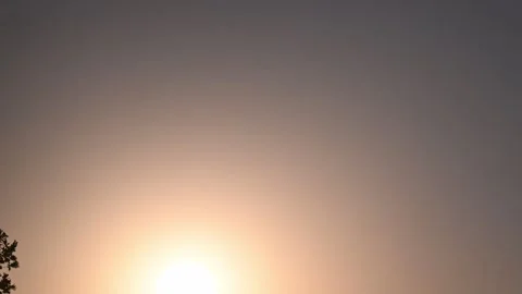 Bright Sun Fading Into Dark Sky During Eclipse Attempt Stock Footage 345010423