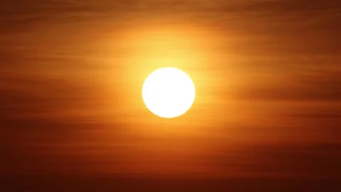 Bright Sun Glowing Through Thin Clouds During A Golden Hour Sunset Stock Footage 342217290