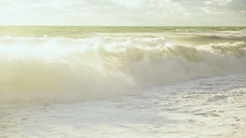 Bright sun illuminates the waves of the storm Stock Footage 82317665