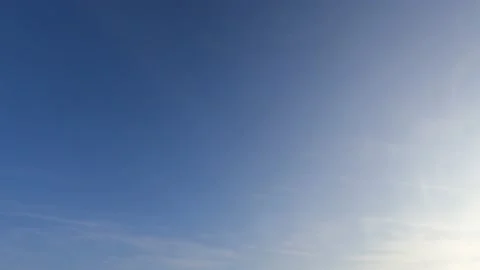 Bright sun light ray on beautiful sunrise clear blue sky background Stock Footage 153462678