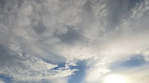 Bright sun light ray with dark rain storm cloud on blue sky line Video stock 168119836