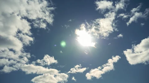 Bright sun light ray flare n sunbeam shining through colorful dark cumulus cloud Stock Footage 294654494