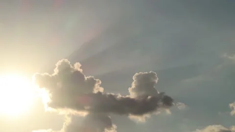 Bright sun light ray n bokeh sunbeam flare shining through white cloud Stock Footage 146685949