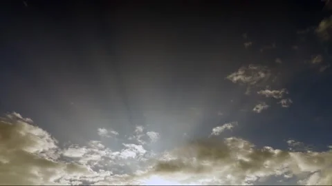 Bright sun light ray n bokeh sunbeam flare shining through white cloud Stock Footage 146937454