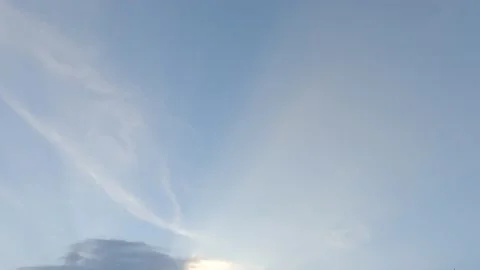 Bright sun light ray n sunbeam break through fast moving white n gray cloud Stock Footage 147071570