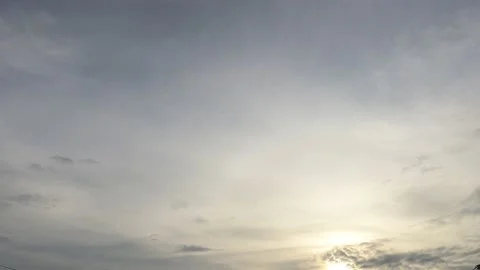 Bright sun light ray n sunbeam flare shining through dramatic golden gray cloud Stock Footage 147393203