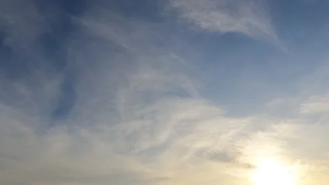 Bright sun light ray n sunbeam shining through dramatic golden gray clouds Video stock 147393448