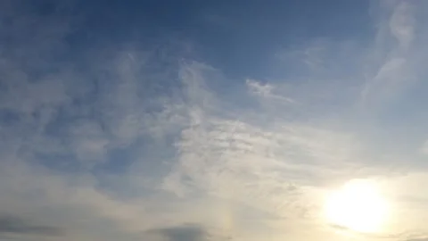 Bright sun light ray n sunbeam flare shining through dramatic golden gray cloud Stock Footage 147393484