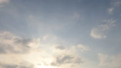 Bright sun light ray n sunbeam shining through cloud on sunny blue sky Video stock 148748130