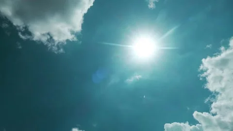 Bright sun light ray n sunbeam shining on beautiful sunny cyan blue sky Stock Footage 155053915