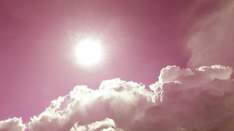 Bright sun light ray n sunbeam on sunny pastel pink sky with fluffy cloud Video stock 165977508
