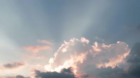 Bright sun light ray n sunbeam shining through pastel orange pink clouds Stock Footage 170004585