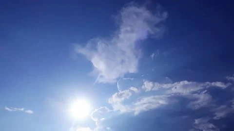 Bright sun light, sunbeams n flares shining through sunrise clouds Stock Footage 148668357