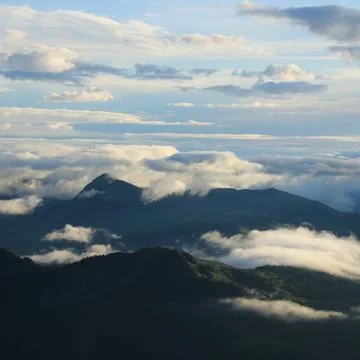 Bright sun lit clouds over the Entlebuch Region, Lucerne Canton. Stock Photos