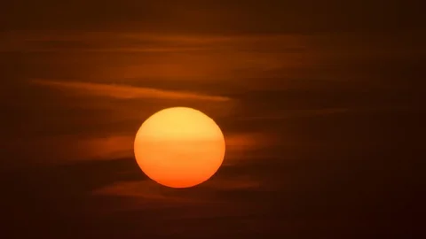 The bright sun on the night cloud background. time lapse Video stock 118883622