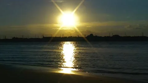 Bright sun over a dark evening river scene Stock Footage 169120319