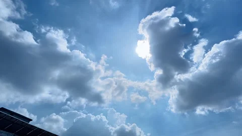 Bright Sun Peeking Through Fluffy Clouds Stock Footage 314887553
