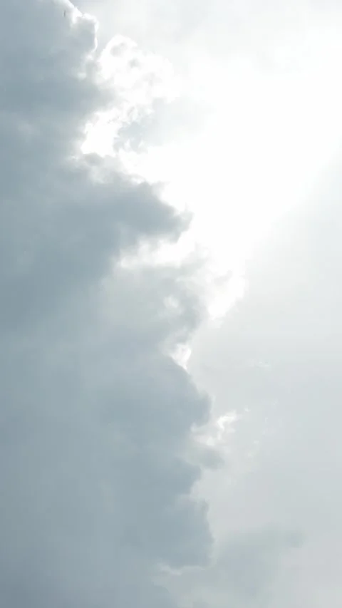 Bright sun rays breaking through dramatic grey storm clouds. Stock Footage 340977521