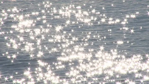Bright sun reflecting off waves Stock Footage 74062559