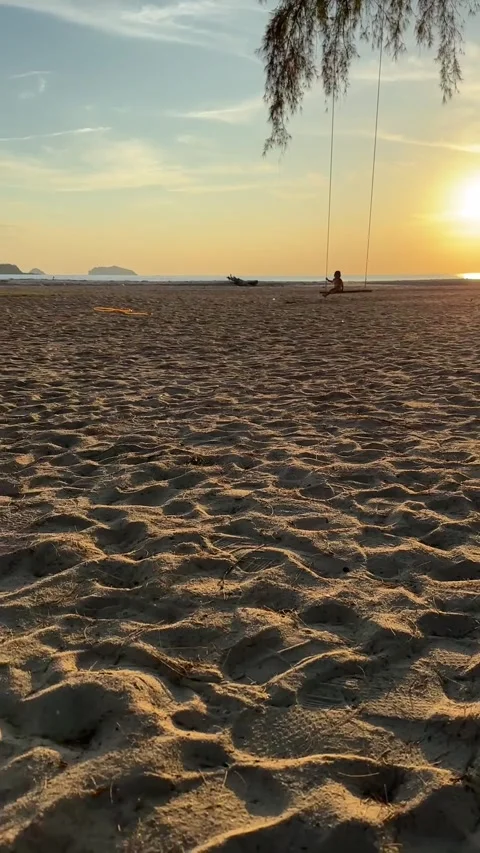 Bright sun shines on the beach in the evening, providing a relaxing warmth. Stock Footage 283045770